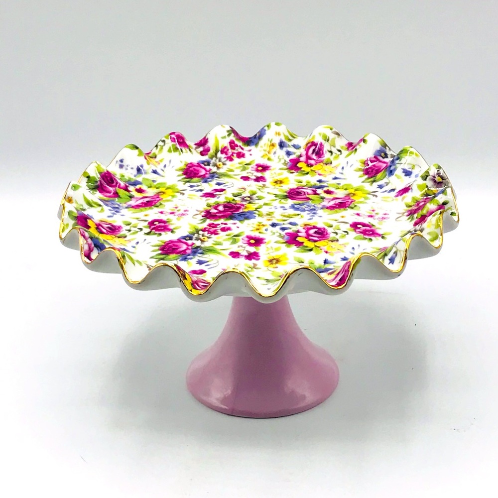 Style by Lava fluted floral dessert plate on lavender pedestal.
